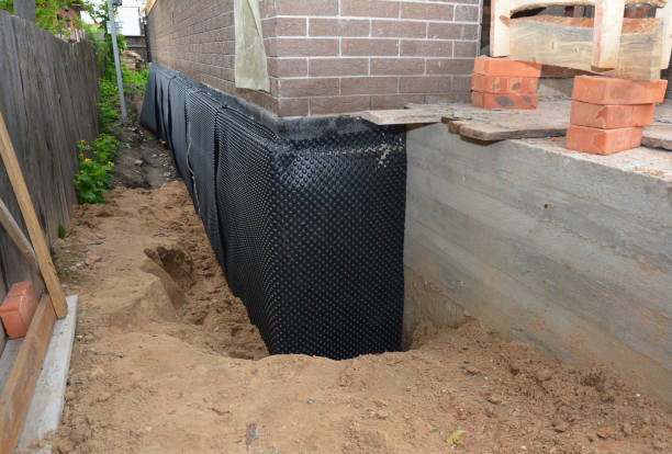 SJ Waterproofing Pros technician performing targeted Vapor Barrier Installation assessment in Vernon, IN
